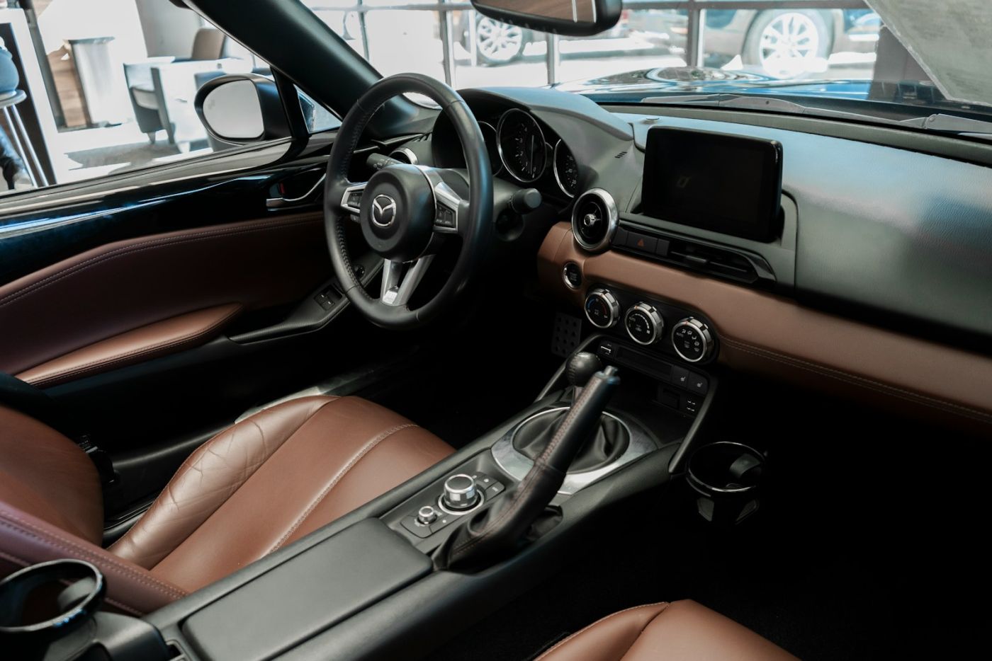 Clean car interior with leather seats after odor treatment