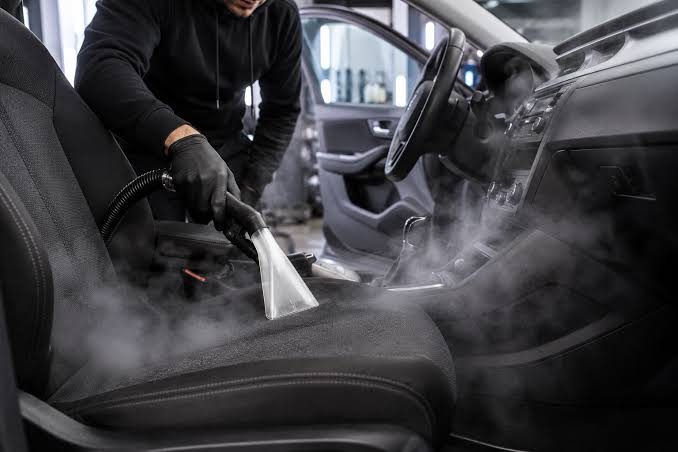 Hot water extraction cleaning a car seat