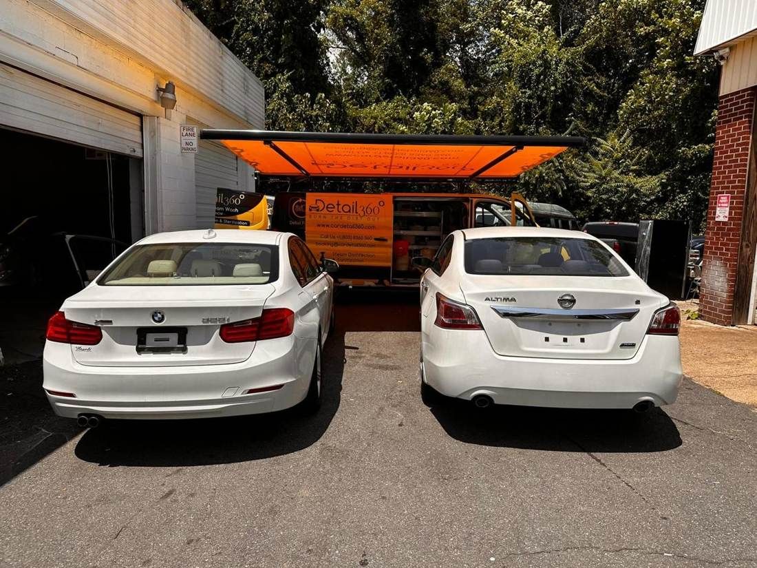 Car Detail 360 van servicing a white BMW 3 Series and Nissan Altima at a commercial location